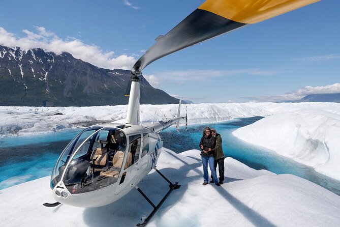 Helicopter flying over Knik Glacier Alaska